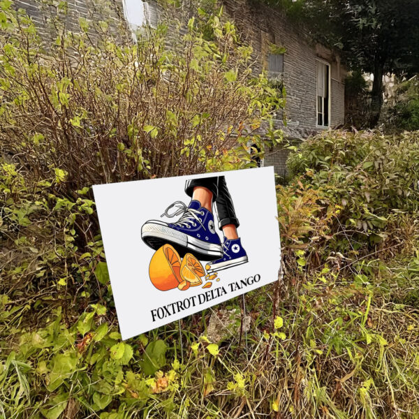 Foxtrot Delta Tango, Chuck Stepping On Hat Yard Sign