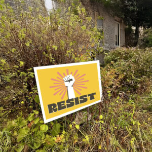 Resist protest sign with burst and raised fist